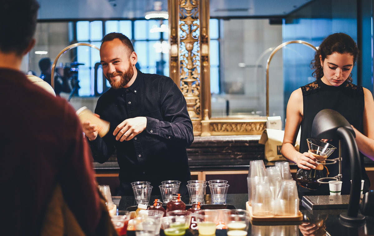 Licensed event bartender pouring a cocktail at a professionally staffed bar