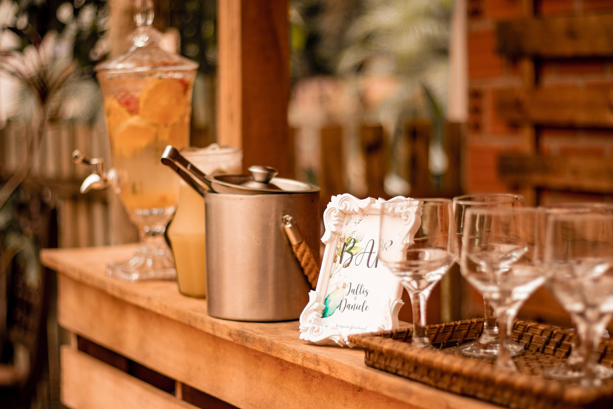 Licensed wedding bartender pouring champagne at a reception bar for guests